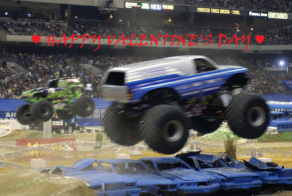 A photo of a monster truck rally with the text, Happy Valentine's Day