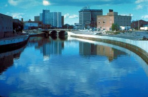 A photo of Flint, Michigan with the Flint River in the foreground, from 1979.